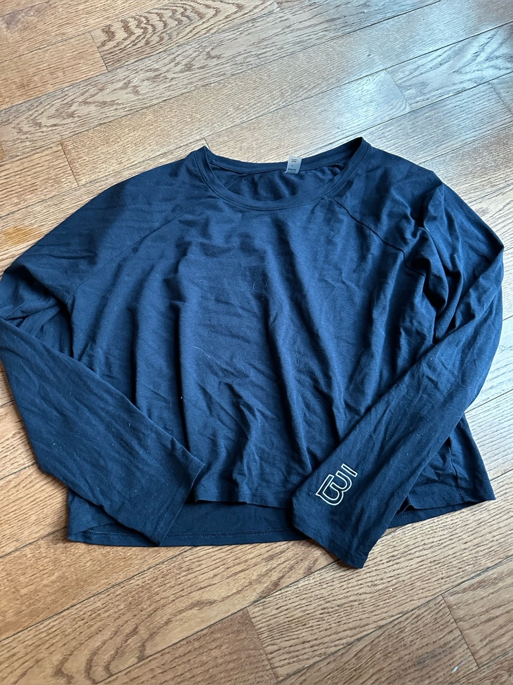 Women's navy Long-Sleeve hip length Top with barre3 Logo